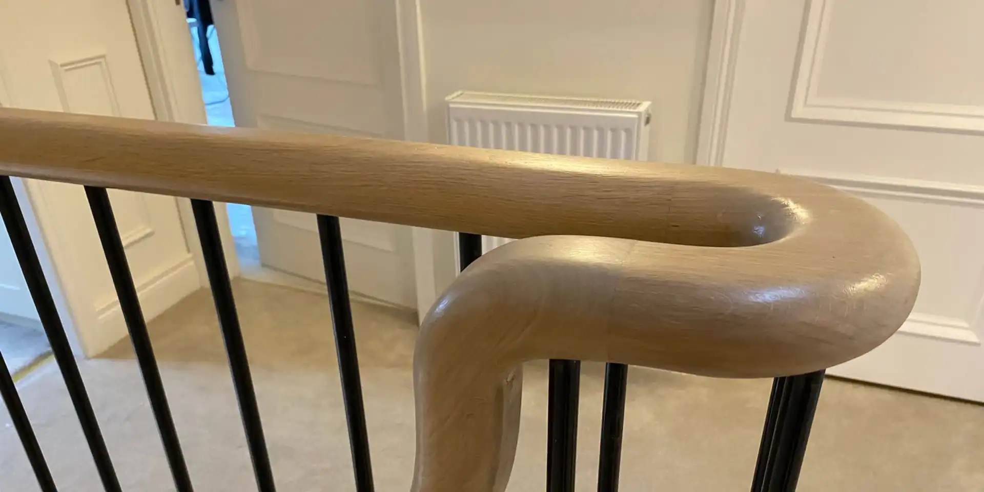 walnut handrail with metal bannisters