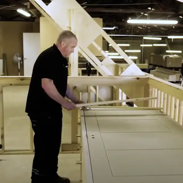 About Us carpenter constructing door