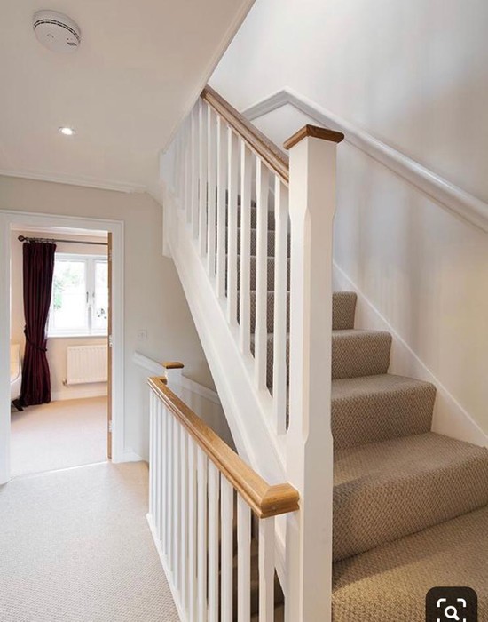 primed stairs with oak handrail and caps banister