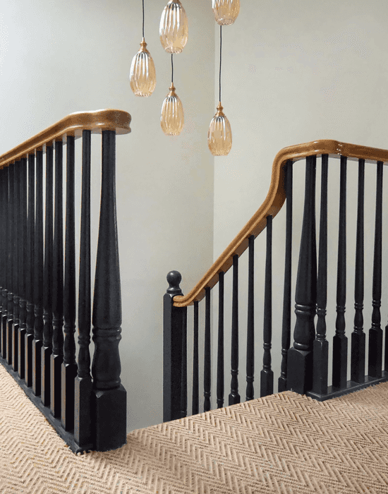 stairs with black bannisters