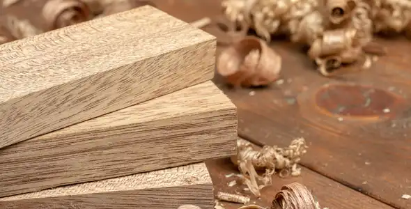 Wood Filings three planks of wood next to wood filings