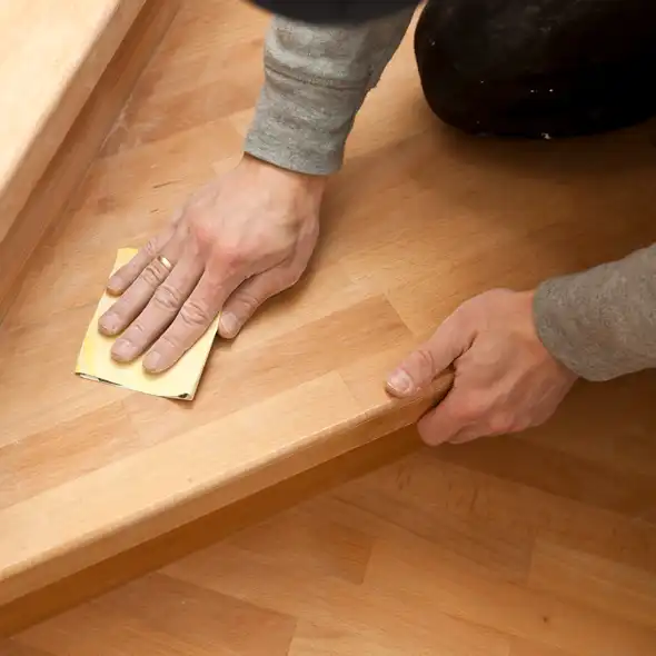 About Us person cleaning stairs